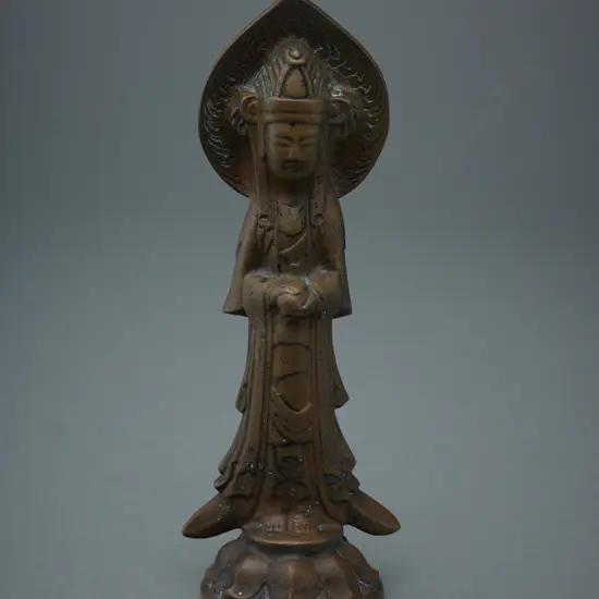 Brass standing figure of Buddha holding peach on lotus base - Tibet/China?,